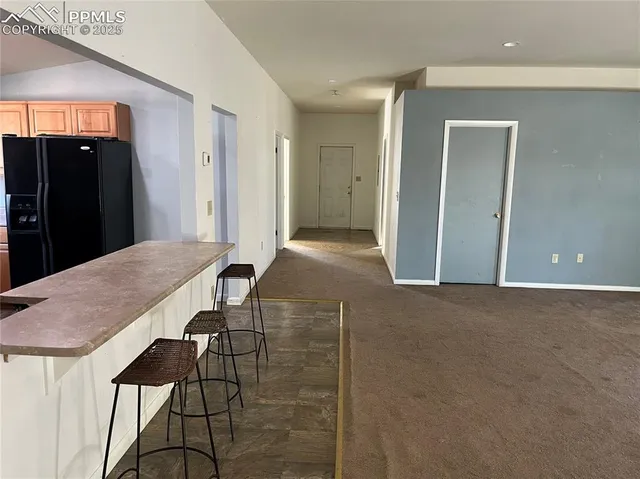 a view of a livingroom with a flat screen tv