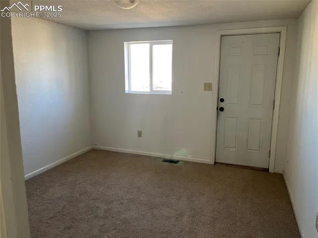 a view of a livingroom with furniture and cabinet
