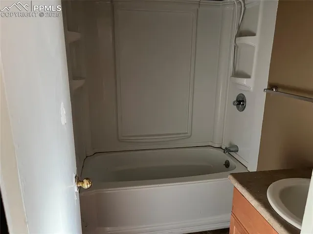 a view of a hallway with a wooden shelves