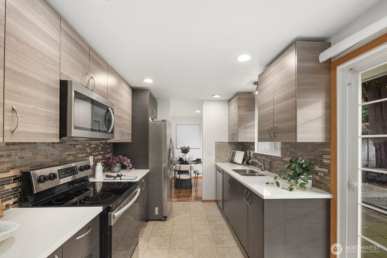 803 Southwest Dash Point Road Federal Way, WA 98023 - Photo 13 of 35 a kitchen with a stove a sink and a refrigerator