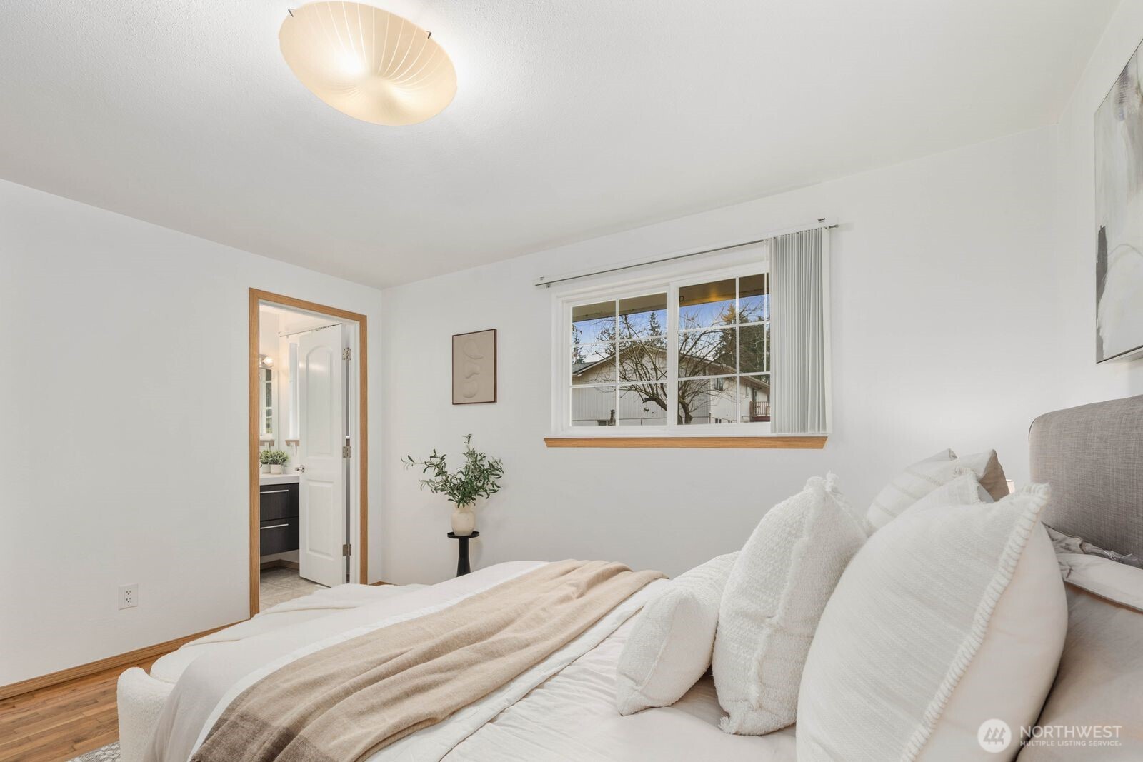 803 Southwest Dash Point Road Federal Way, WA 98023 - Photo 20 of 35 a bedroom with a bed and a painting on the wall