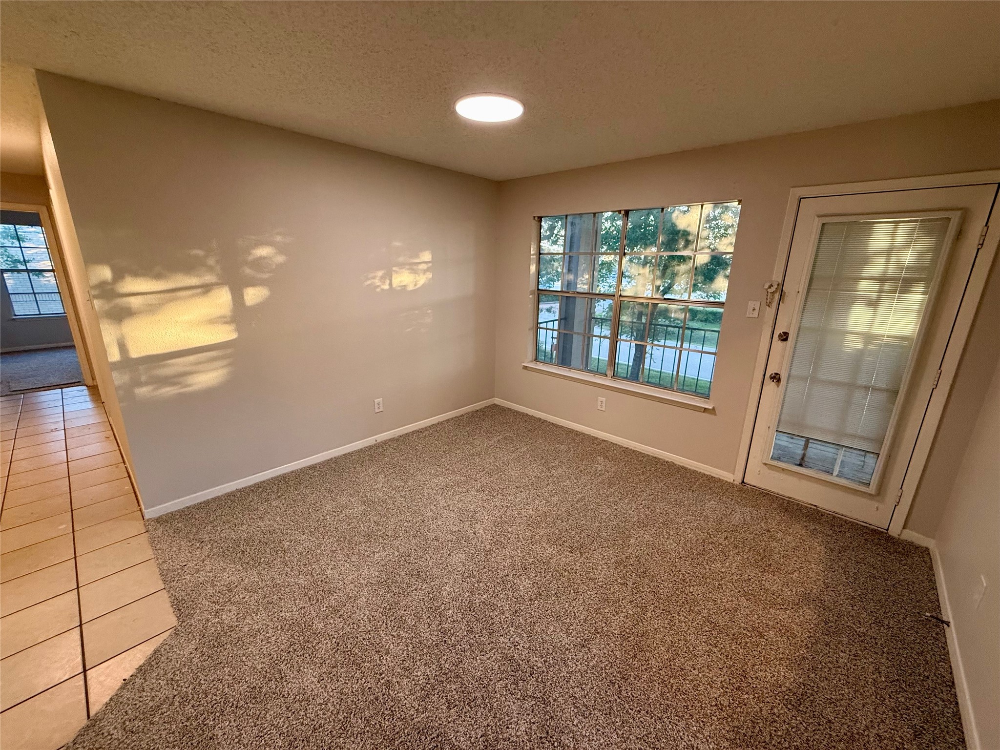 25144 Budde Road, Unit 7 Spring, TX 77380 - Photo 4 of 7 en empty room with windows