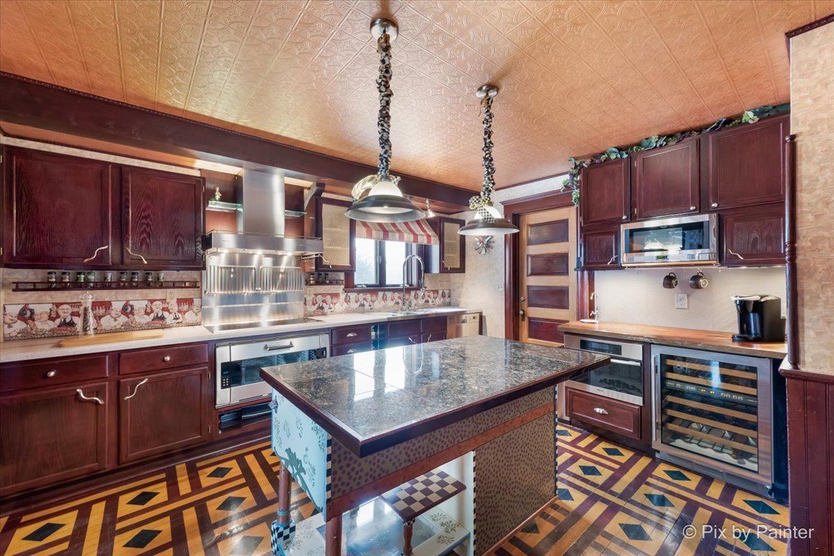 11004 Vanderkarr Road Hebron, IL 60034 - Photo 12 of 35 a kitchen with stainless steel appliances granite countertop a stove and a cabinets