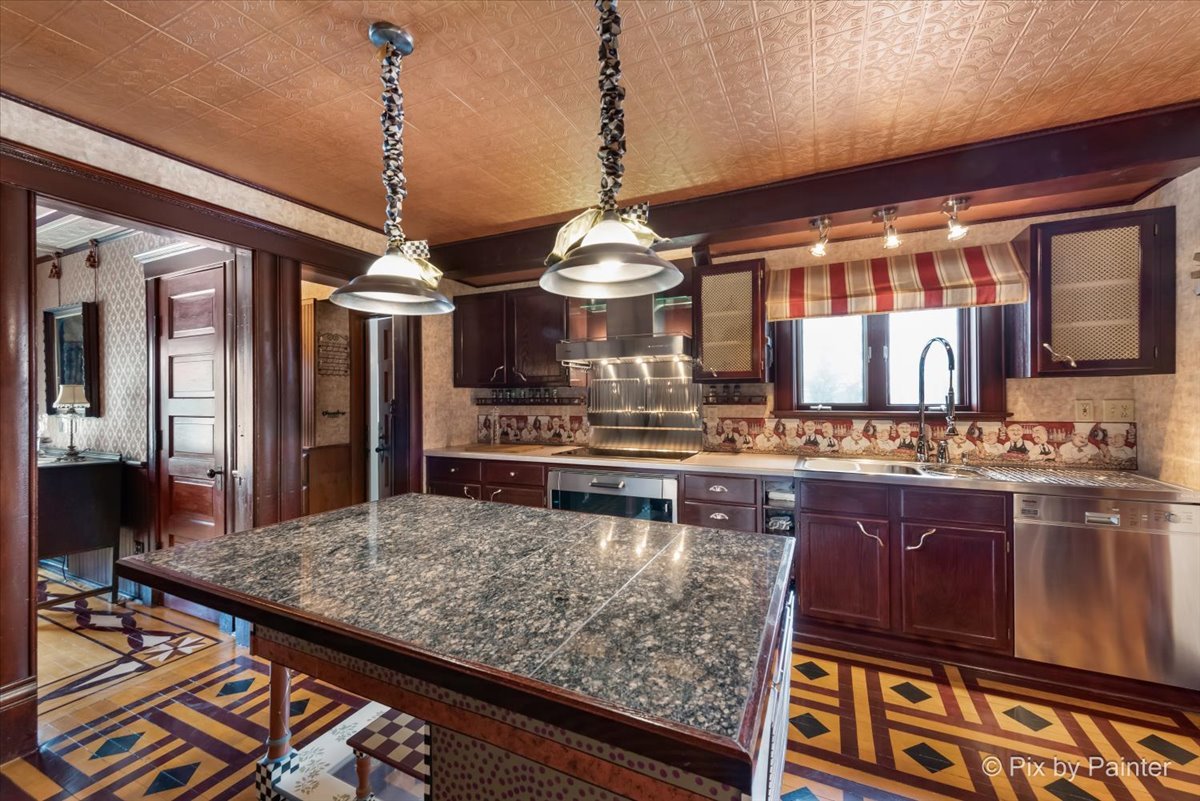 11004 Vanderkarr Road Hebron, IL 60034 - Photo 13 of 35 a kitchen with stainless steel appliances granite countertop a stove and a sink