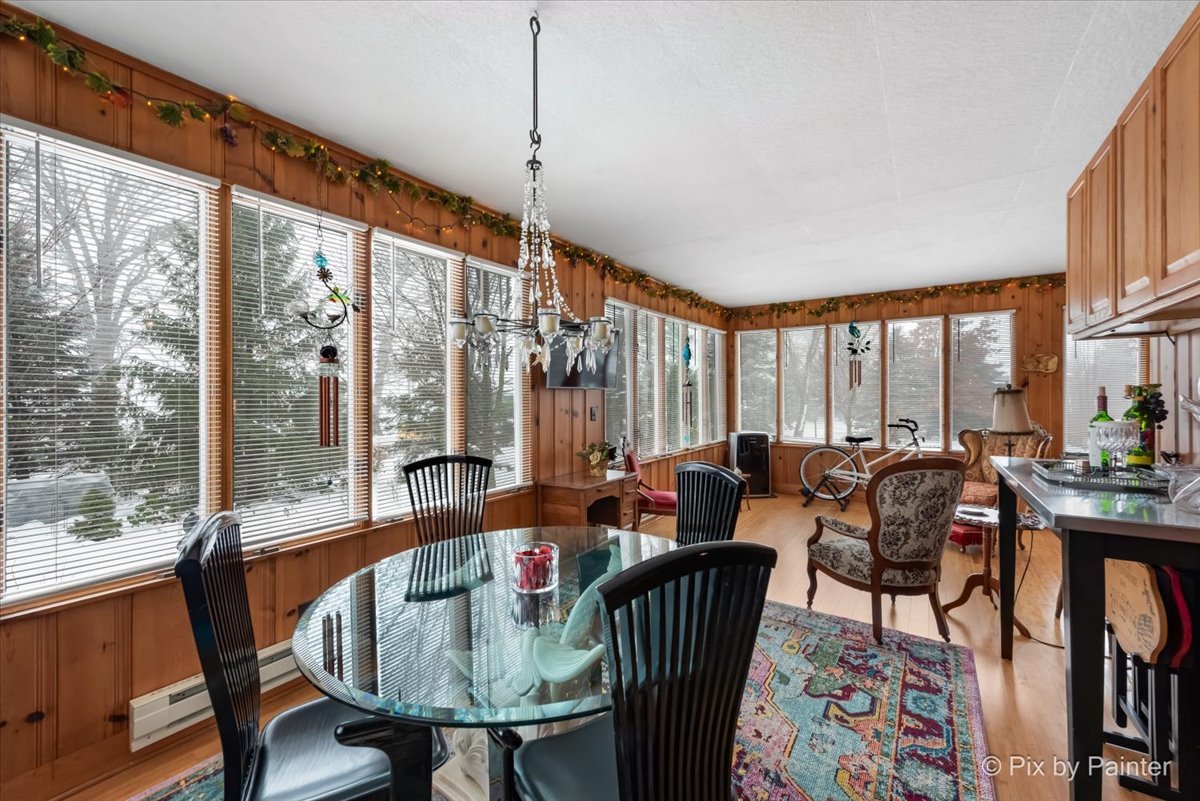 11004 Vanderkarr Road Hebron, IL 60034 - Photo 16 of 35 a very nice looking living room with a large window and dining table