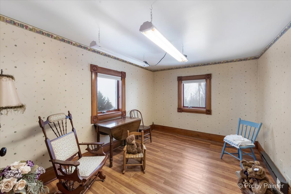 11004 Vanderkarr Road Hebron, IL 60034 - Photo 23 of 35 a workspace with wooden floor and a mirror