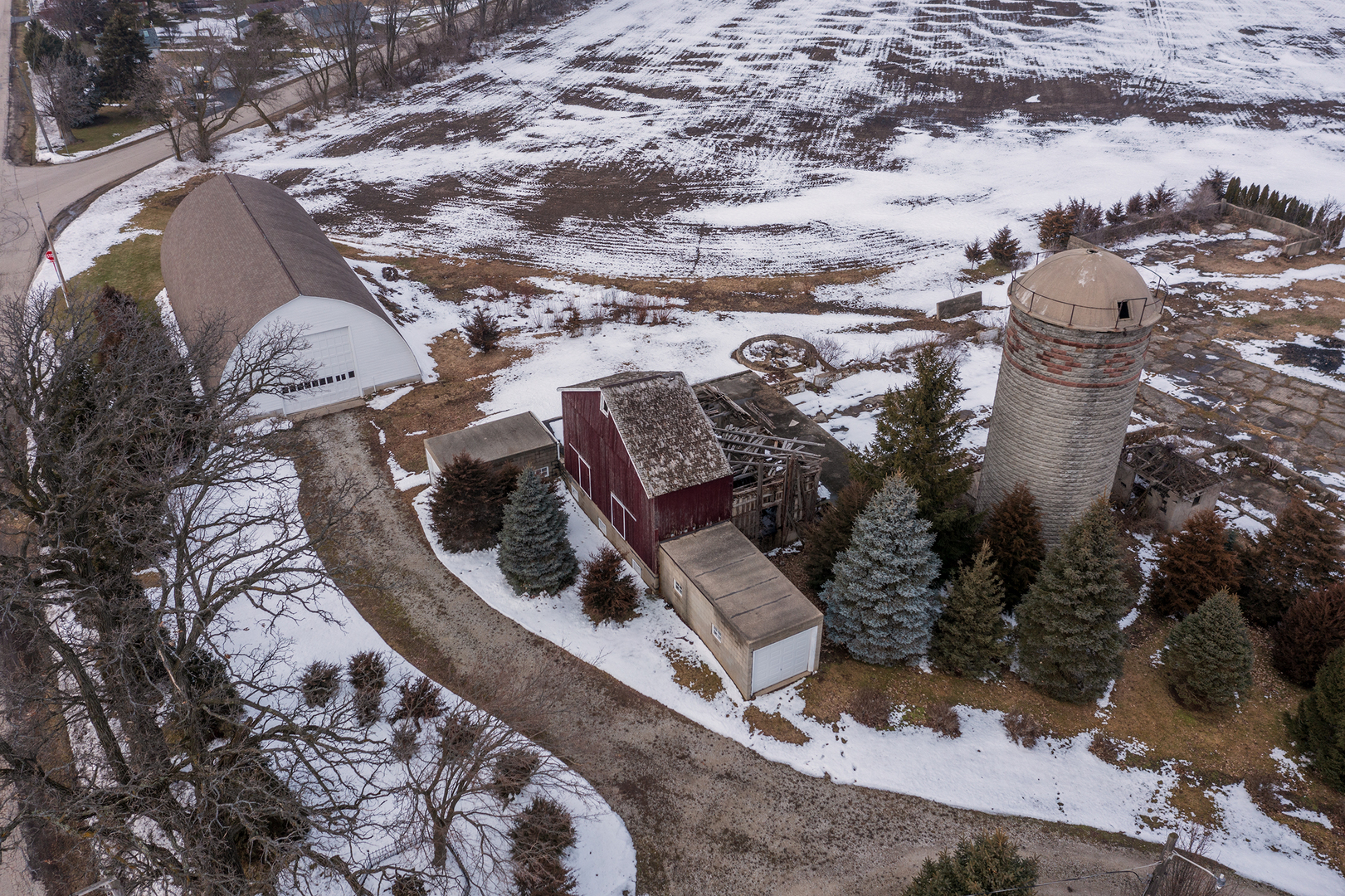 11004 Vanderkarr Road Hebron, IL 60034 - Photo 3 of 35 an aerial view of a house with a yard and large trees