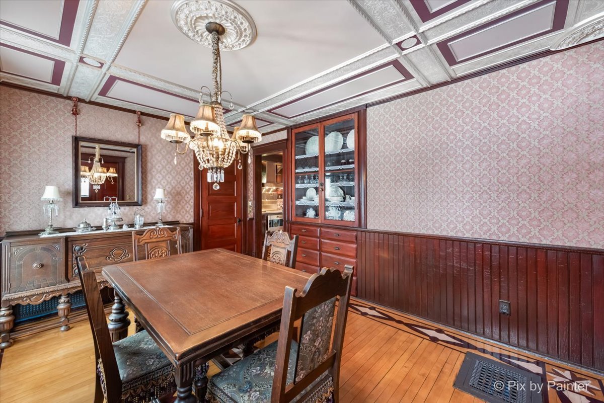 11004 Vanderkarr Road Hebron, IL 60034 - Photo 6 of 35 a view of a dining room with furniture and chandelier