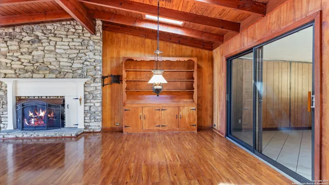 a kitchen with stainless steel appliances a stove microwave and sink