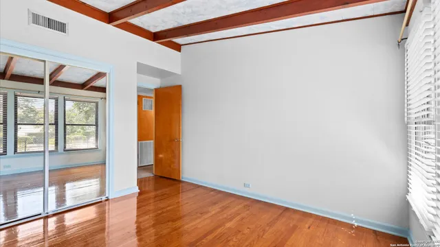 a view of an empty room with a window