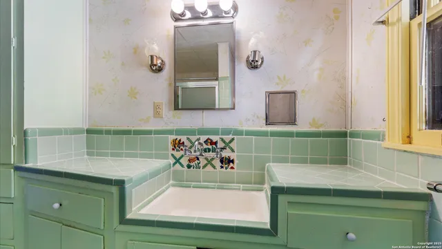 a bathroom with a shower and a window