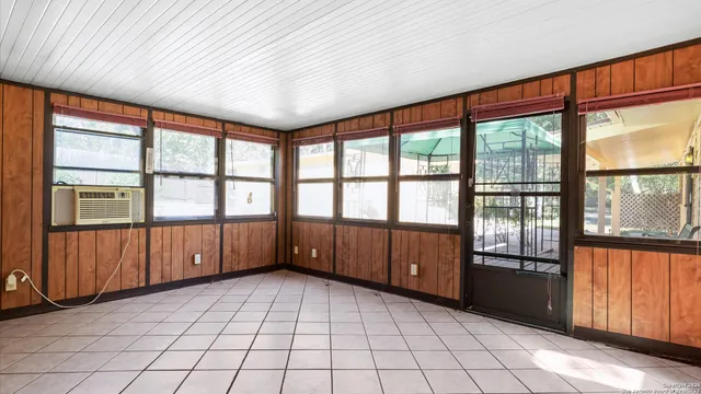 a view of a house with backyard sitting area and garden