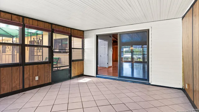 a view of a house with backyard and a garden