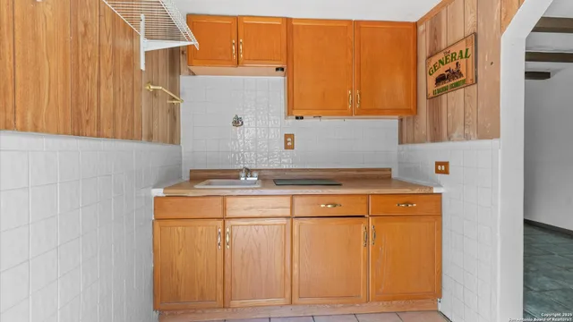 a view of a park with large trees