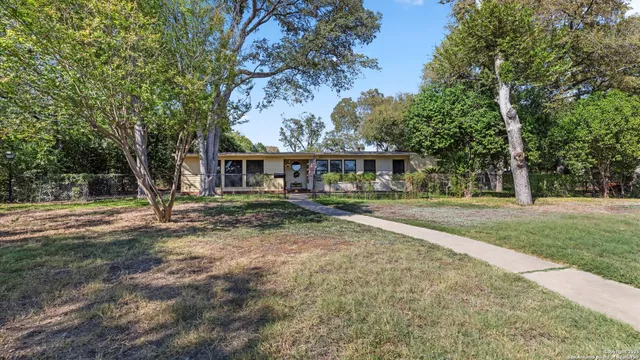 a view of a backyard with sitting area