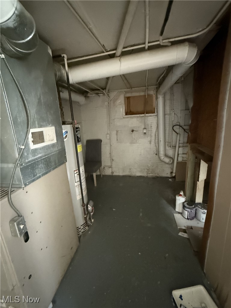877 Garfield Street Akron, OH 44310 - Photo 8 of 16 Unfinished below grade area featuring gas water heater