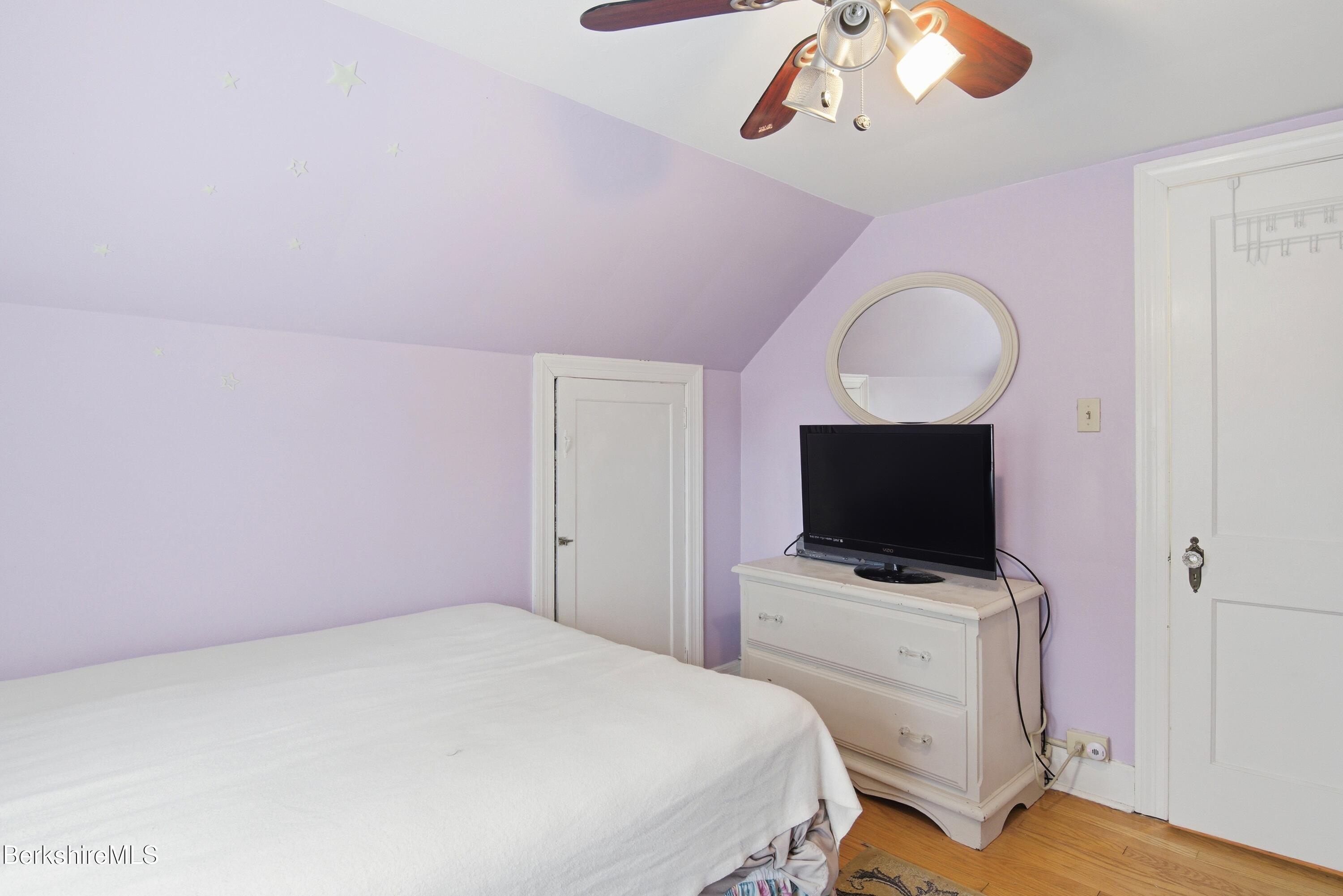 53 Edison Avenue Pittsfield, MA 01201 - Photo 20 of 45 a bedroom with a bed and a flat screen tv