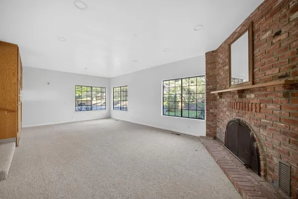a view of livingroom with furniture and a fireplace