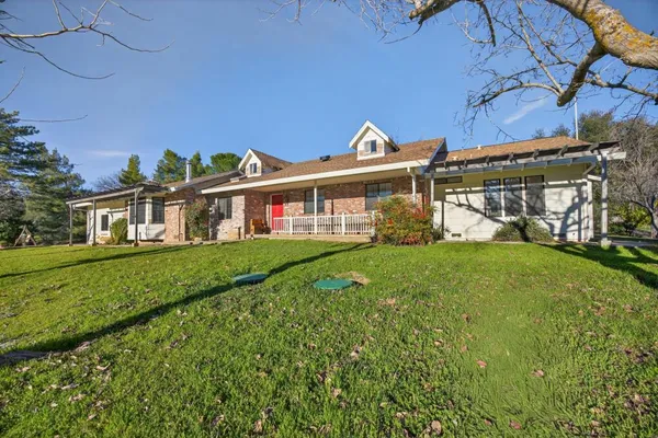a front view of a house with garden