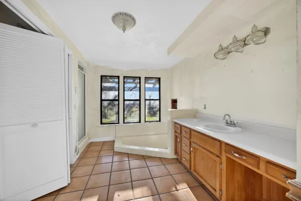 a view of a kitchen with a dishwasher and a refrigerator