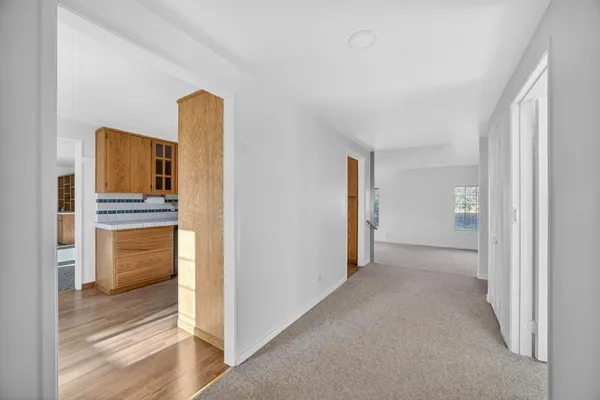 a view of a kitchen cabinets and wooden floor