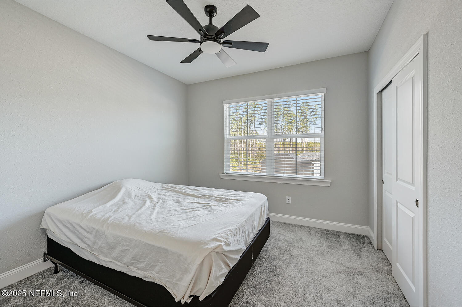 264 Vly Fls Way St. Johns, FL 32259 - Photo 28 of 37 a bedroom with a bed and a window
