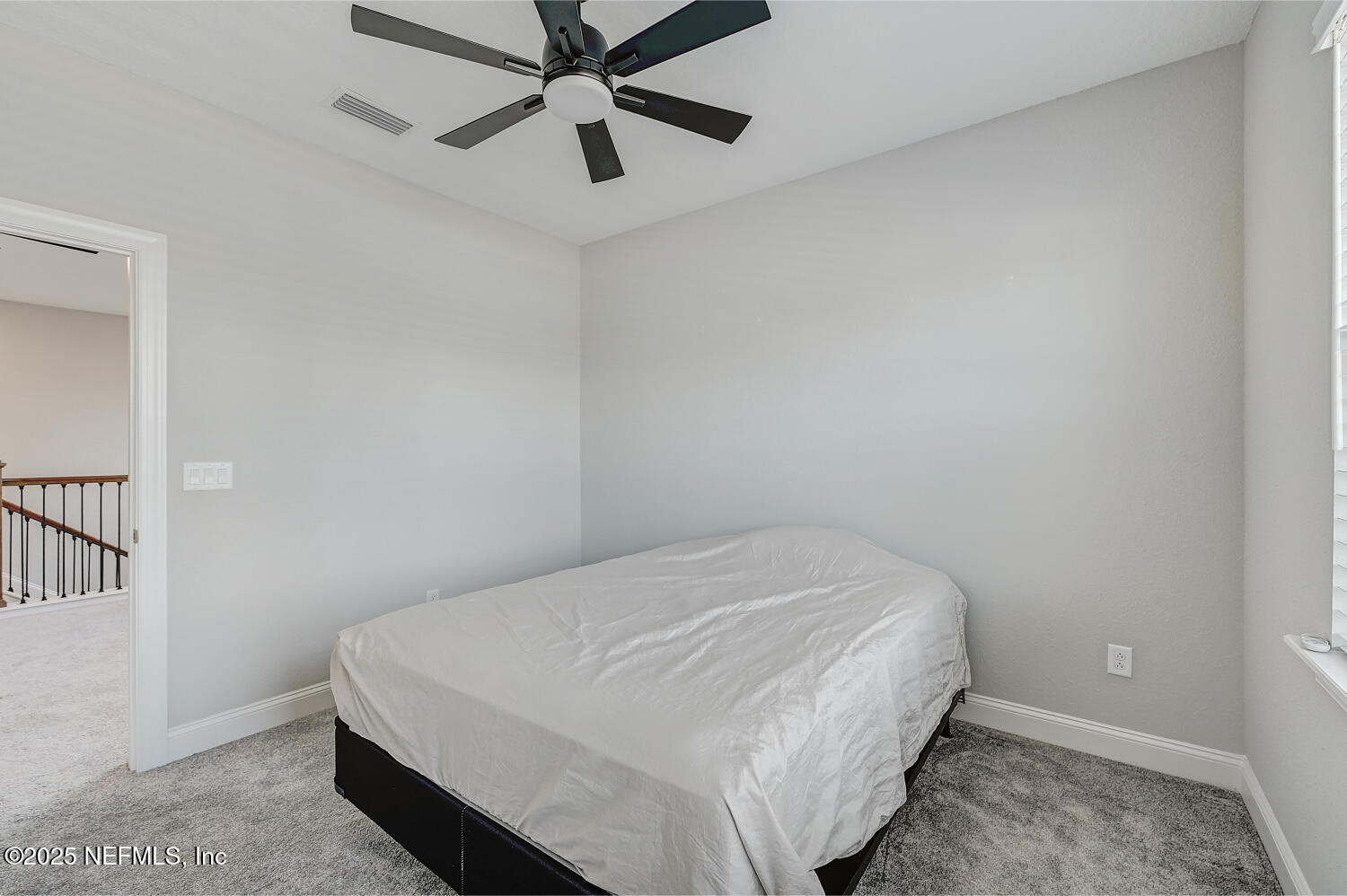 264 Vly Fls Way St. Johns, FL 32259 - Photo 29 of 37 a bedroom with a bed and a chandelier fan