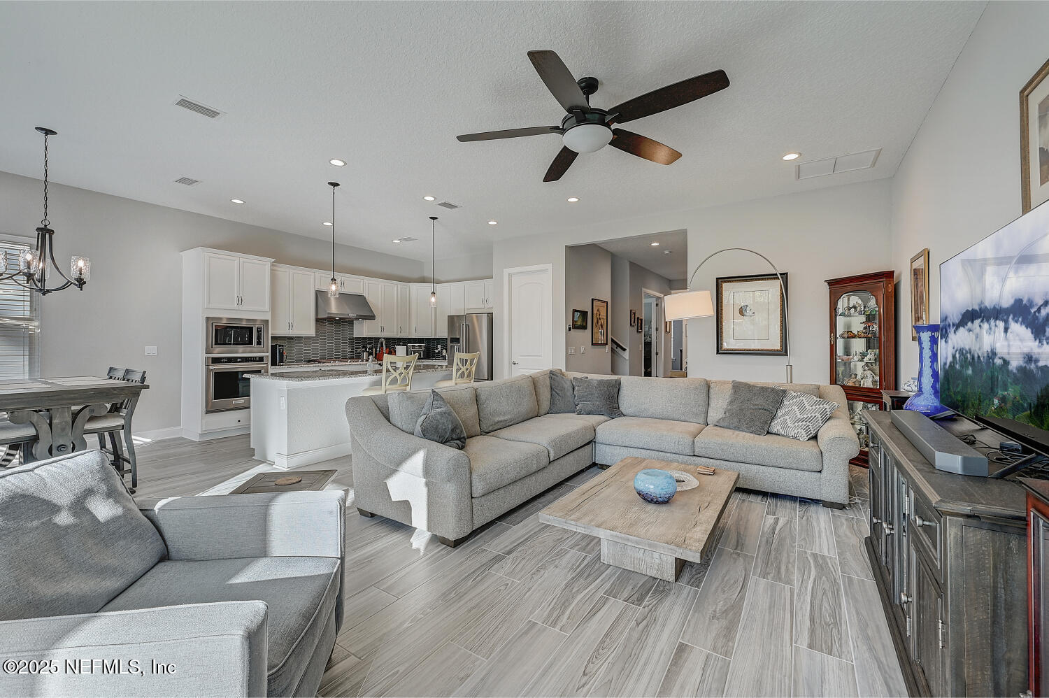 264 Vly Fls Way St. Johns, FL 32259 - Photo 3 of 37 a living room with furniture kitchen view and a wooden floor