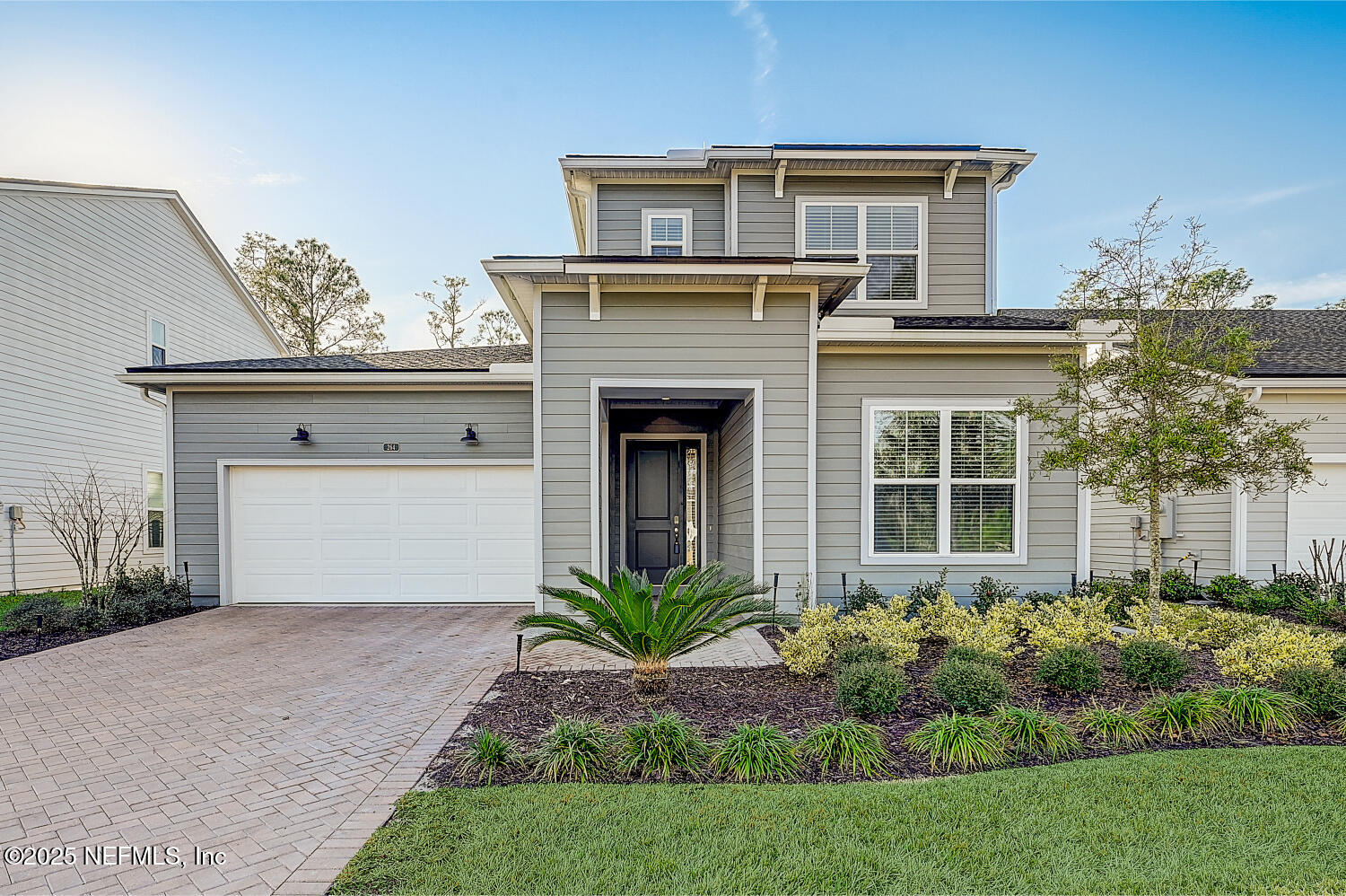 264 Vly Fls Way St. Johns, FL 32259 - Photo 6 of 37 a front view of a house with a garden and plants