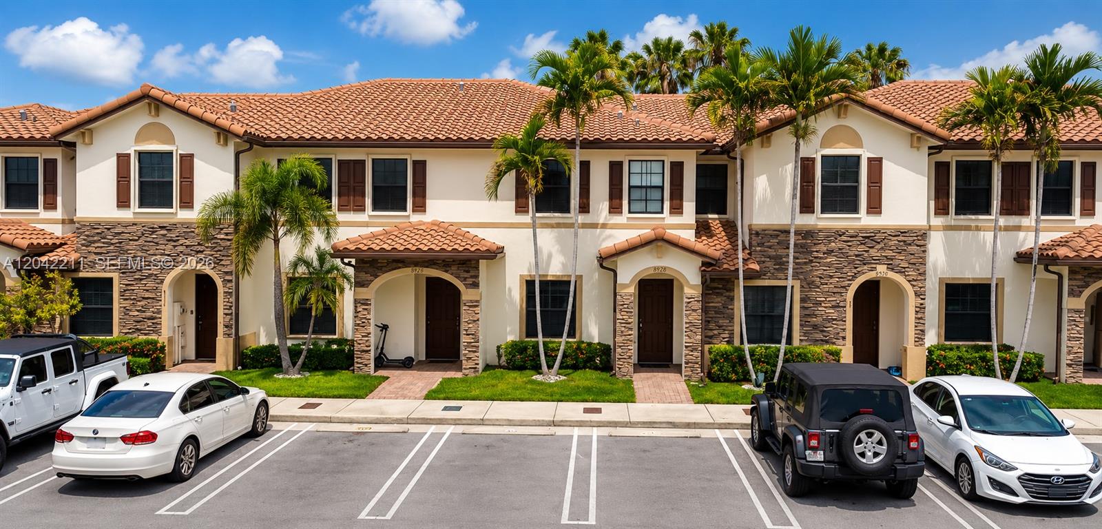 8954 West 35th Way Hialeah, FL 33018 - Photo 1 of 24 a couple of cars parked in front of a house