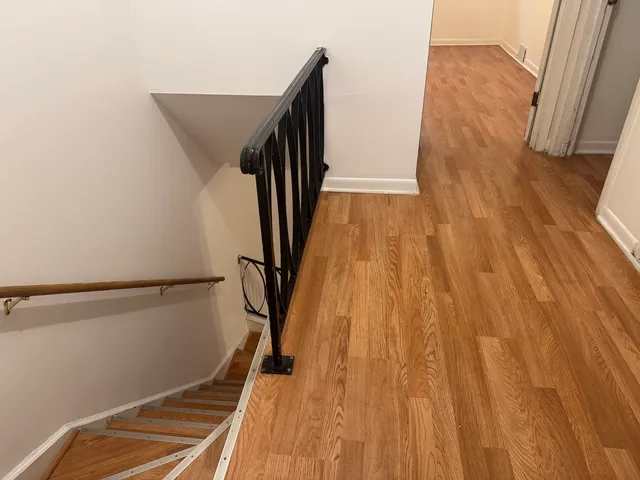 a view of balcony with wooden floor