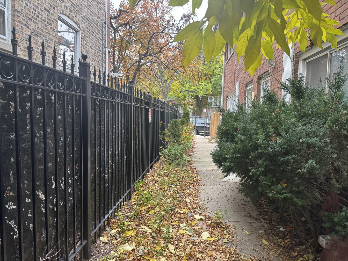 1634 West Morse Avenue, Unit C Chicago, IL 60626 - Photo 26 of 27 a view of a pathway of a house with wooden fence