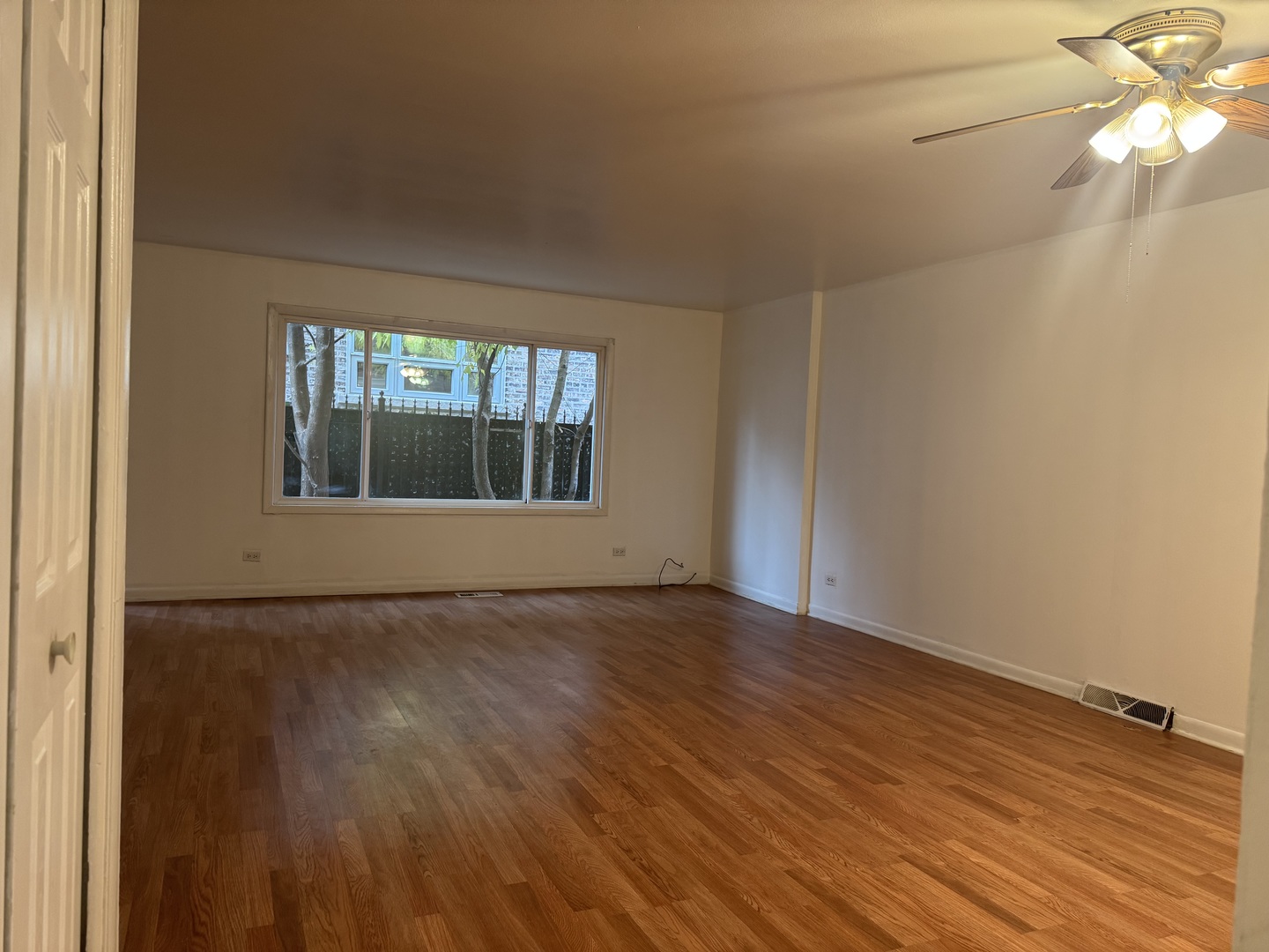 1634 West Morse Avenue, Unit C Chicago, IL 60626 - Photo 10 of 27 wooden floor in an empty room