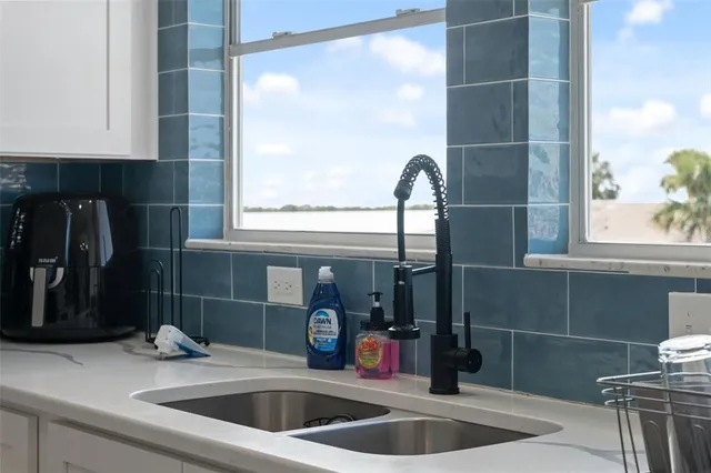 a bedroom with a large bed and a large window