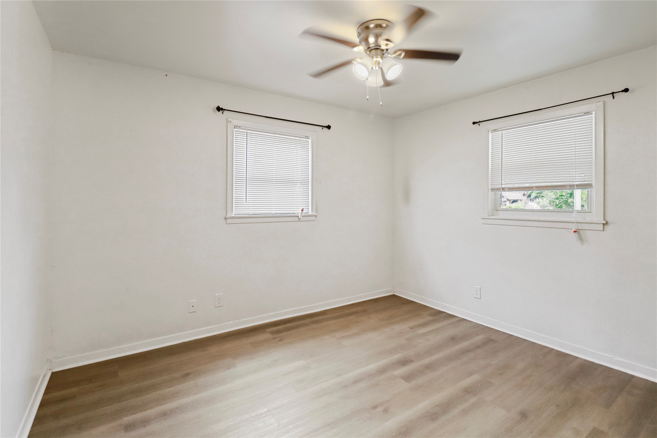 604 West Peach Street Angleton, TX 77515 - Photo 13 of 15 a view of empty room with wooden floor