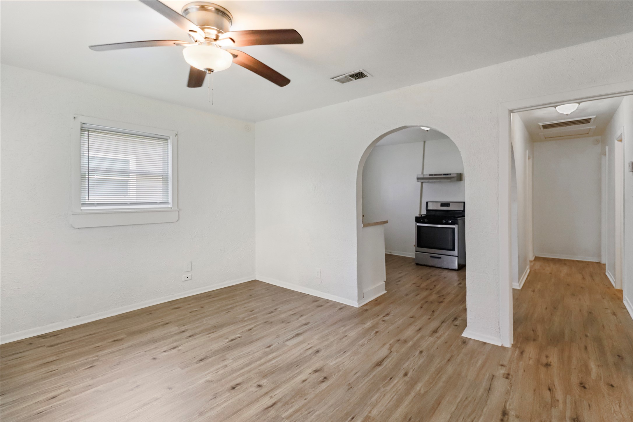 604 West Peach Street Angleton, TX 77515 - Photo 8 of 15 a view of empty room with wooden floor