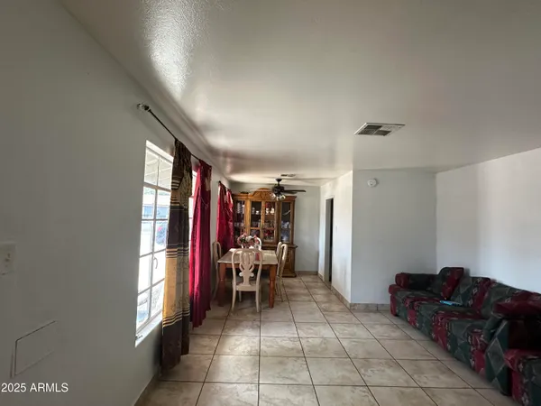 a bed room with furniture and a window