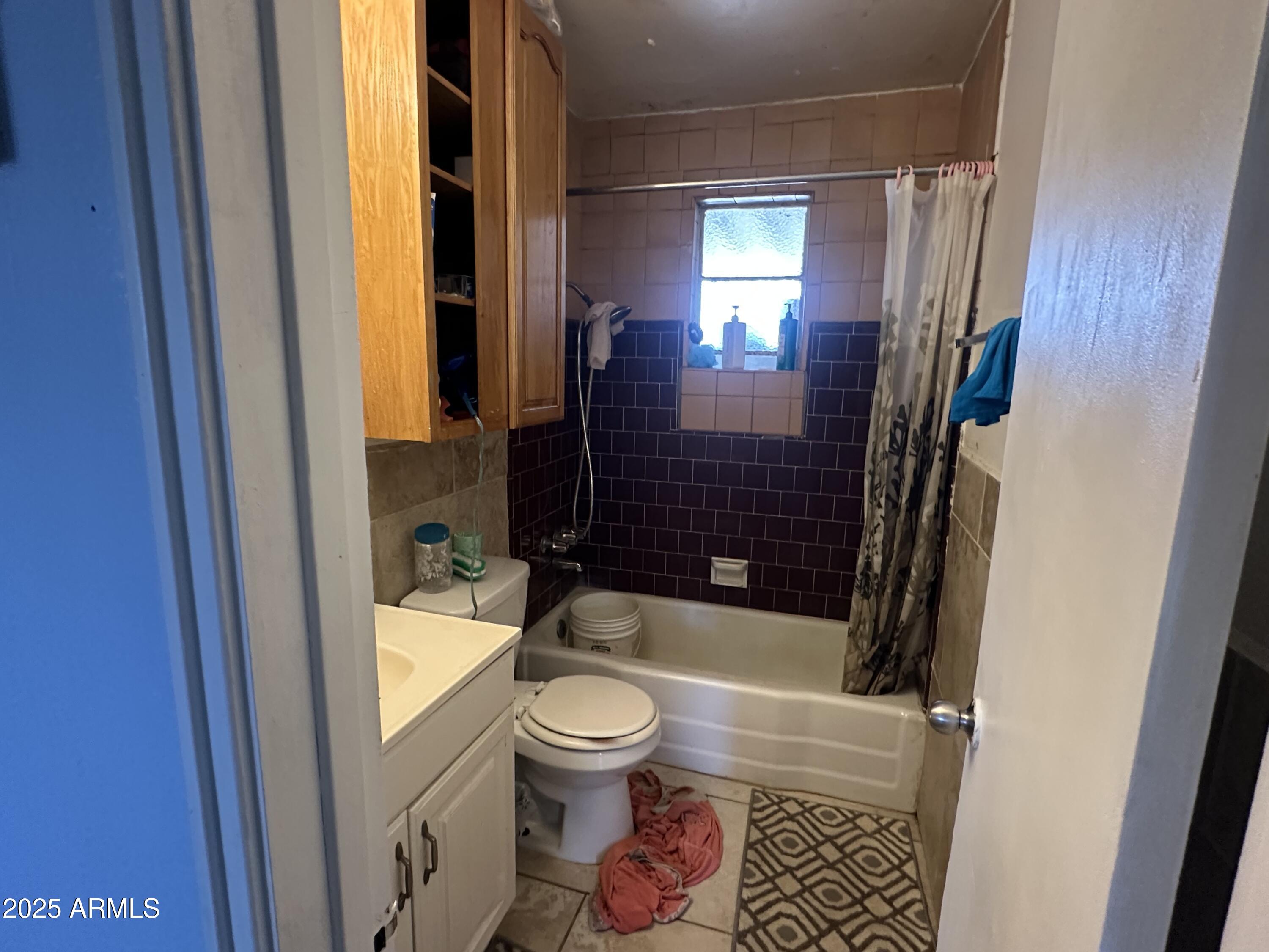 3117 West Roma Avenue Phoenix, AZ 85017 - Photo 14 of 30 a bathroom with a toilet and a shower