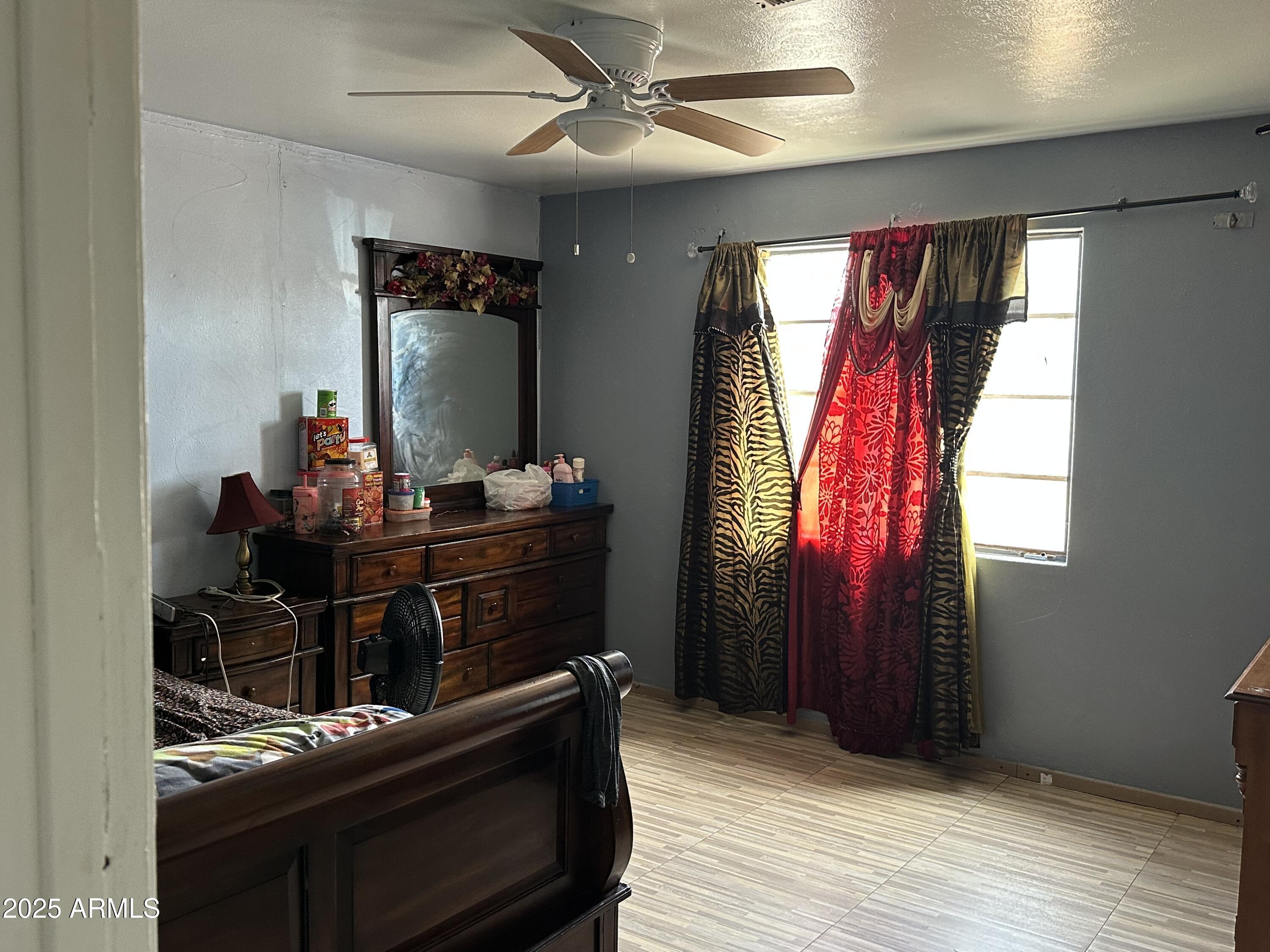 3117 West Roma Avenue Phoenix, AZ 85017 - Photo 17 of 30 a room with furniture and window