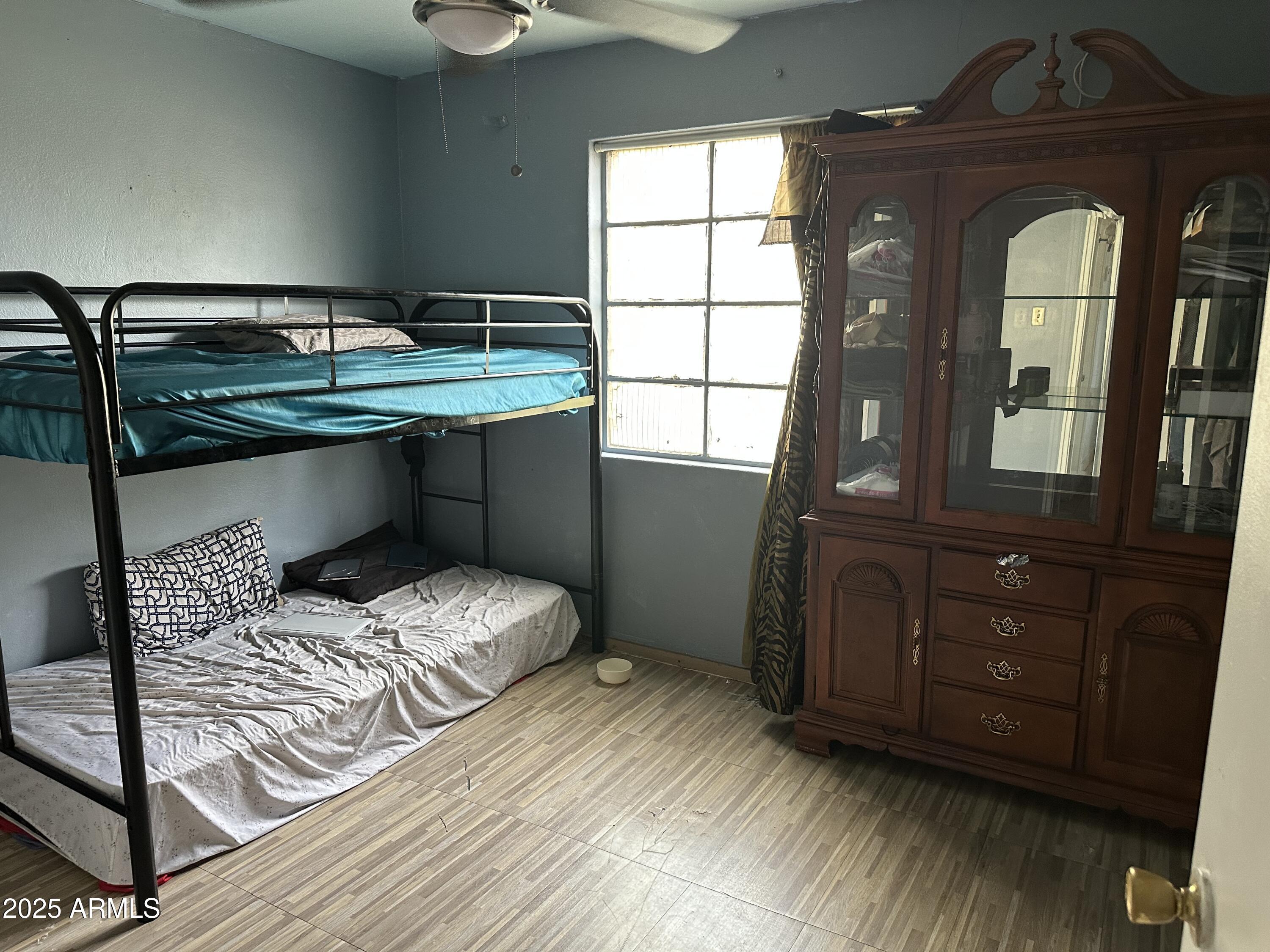 3117 West Roma Avenue Phoenix, AZ 85017 - Photo 20 of 30 a bedroom with a bed and a window