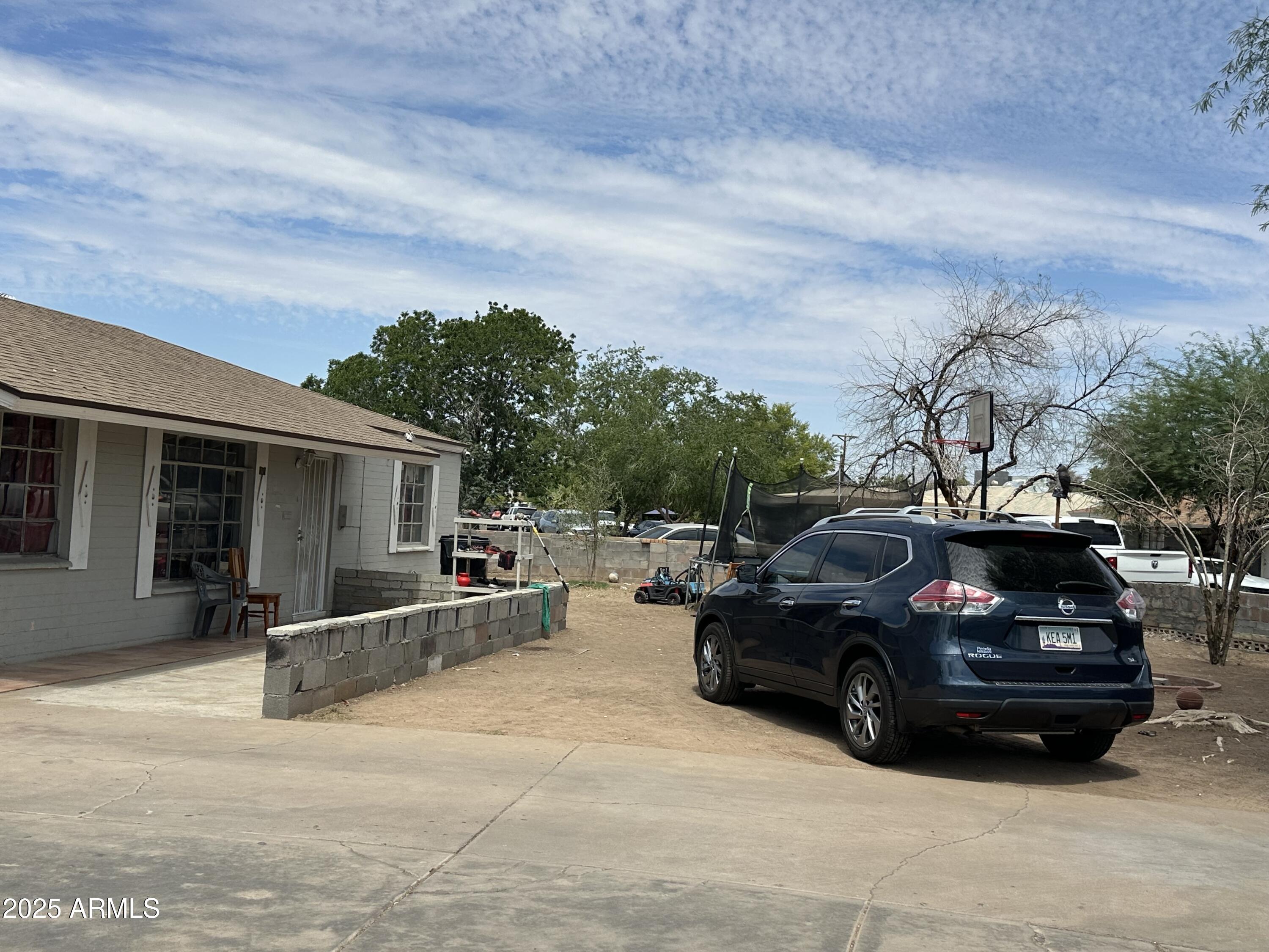 3117 West Roma Avenue Phoenix, AZ 85017 - Photo 2 of 30 a view of a car parked in front of a house