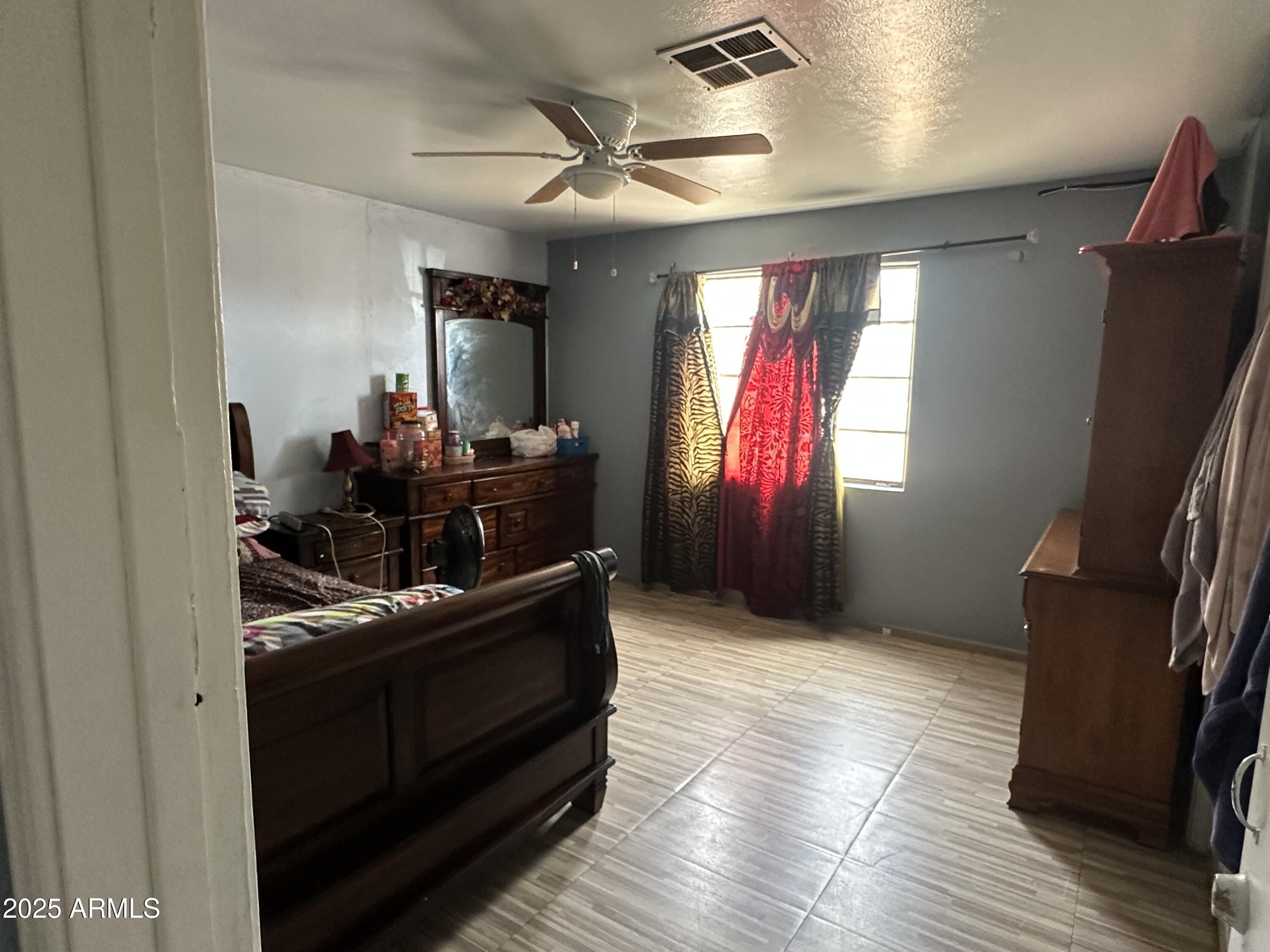3117 West Roma Avenue Phoenix, AZ 85017 - Photo 23 of 30 a living room with furniture and a flat screen tv