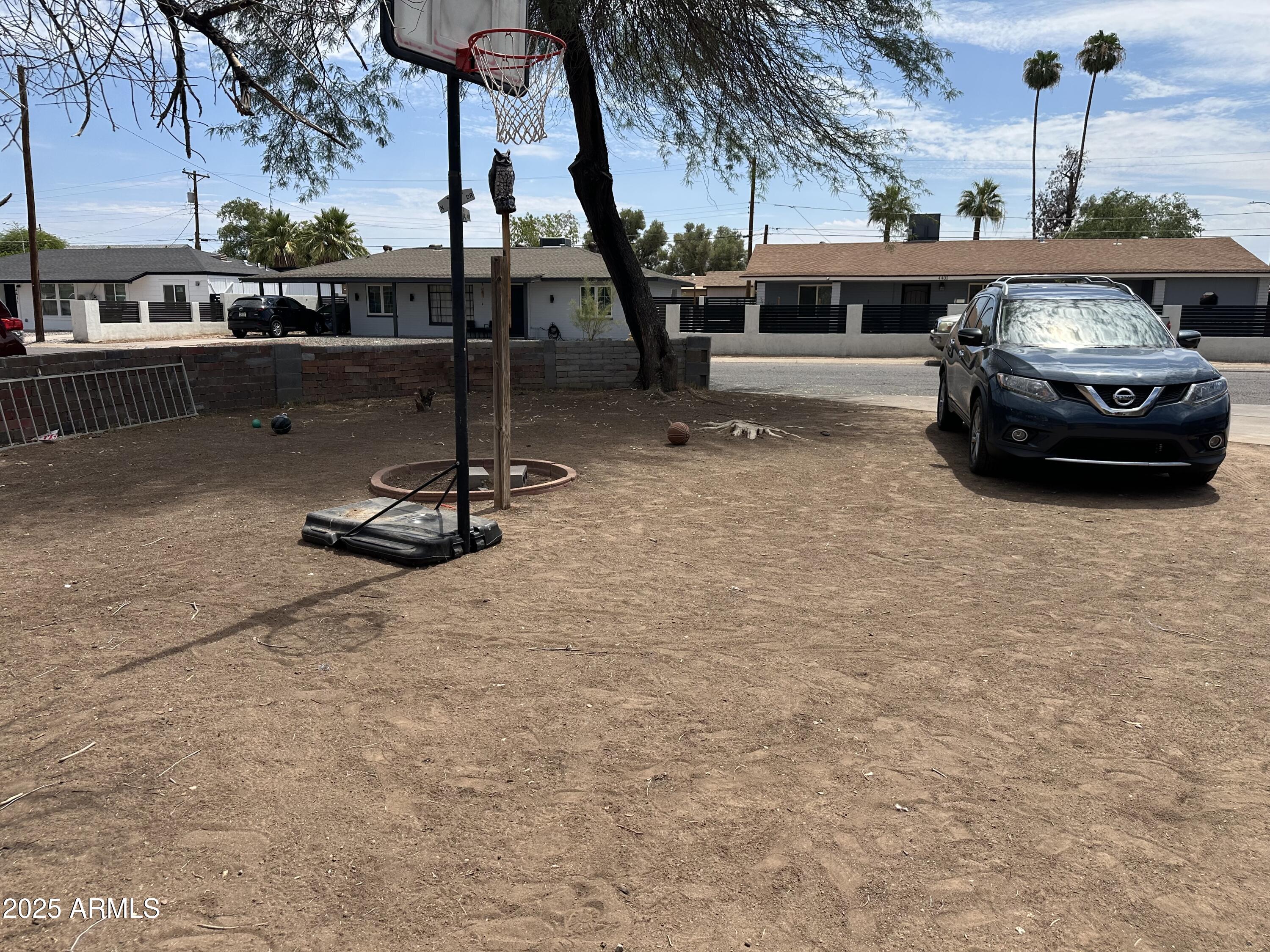 3117 West Roma Avenue Phoenix, AZ 85017 - Photo 3 of 30 a car parked on the side of the road