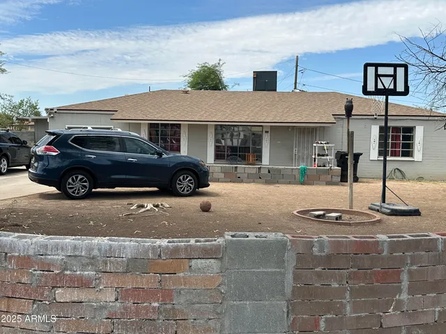a car parked in front of a house