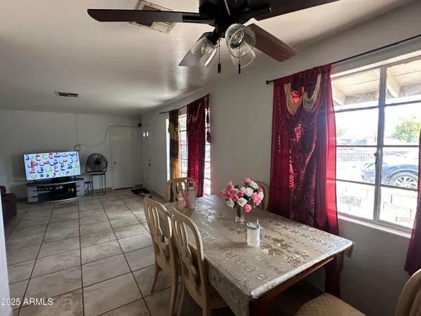 a view of a dining room with furniture window and outside view