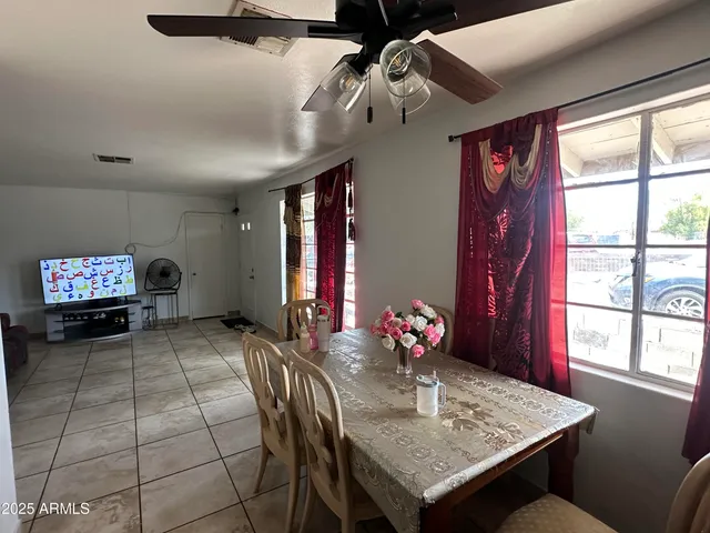 a view of a dining room with furniture window and outside view