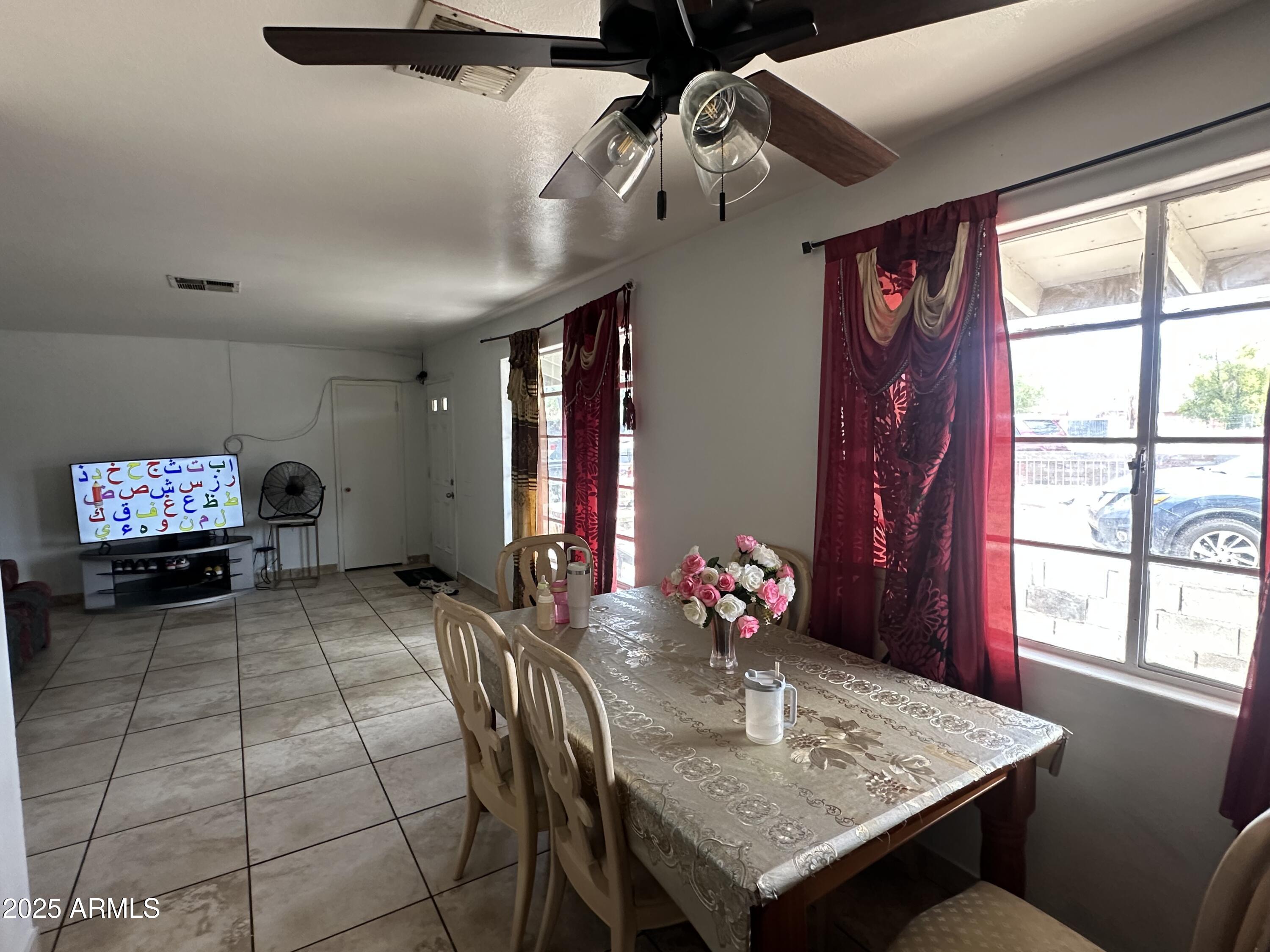 3117 West Roma Avenue Phoenix, AZ 85017 - Photo 10 of 30 a view of a dining room with furniture window and outside view