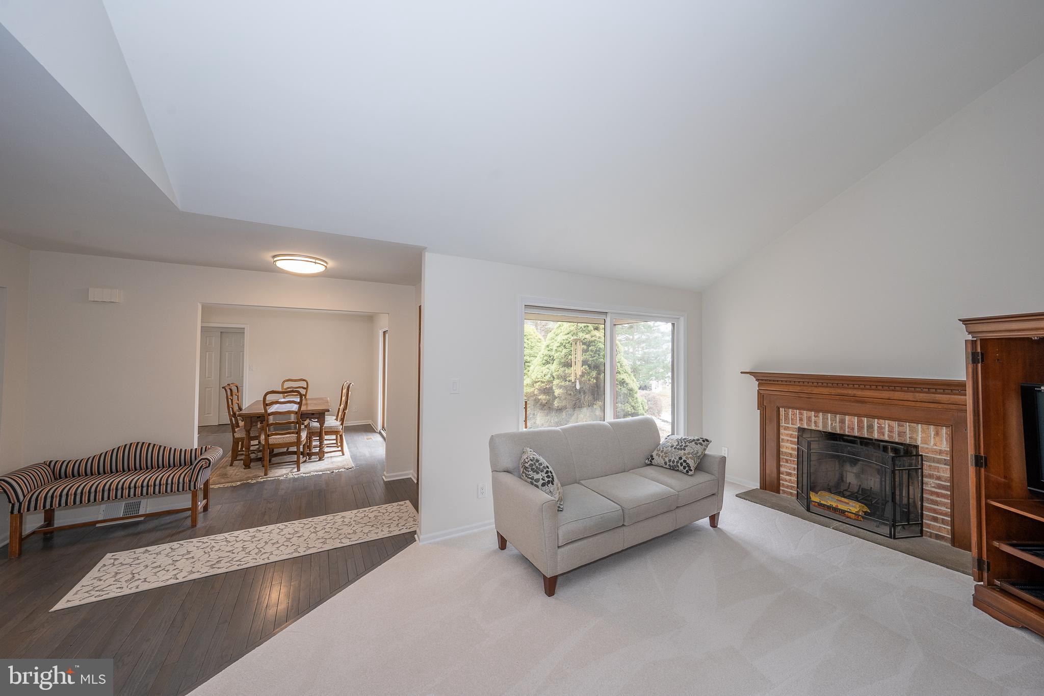 8 Applewood Road Malvern, PA 19355 - Photo 11 of 63 Living Room w/Wood Burning Fireplace & Sliders