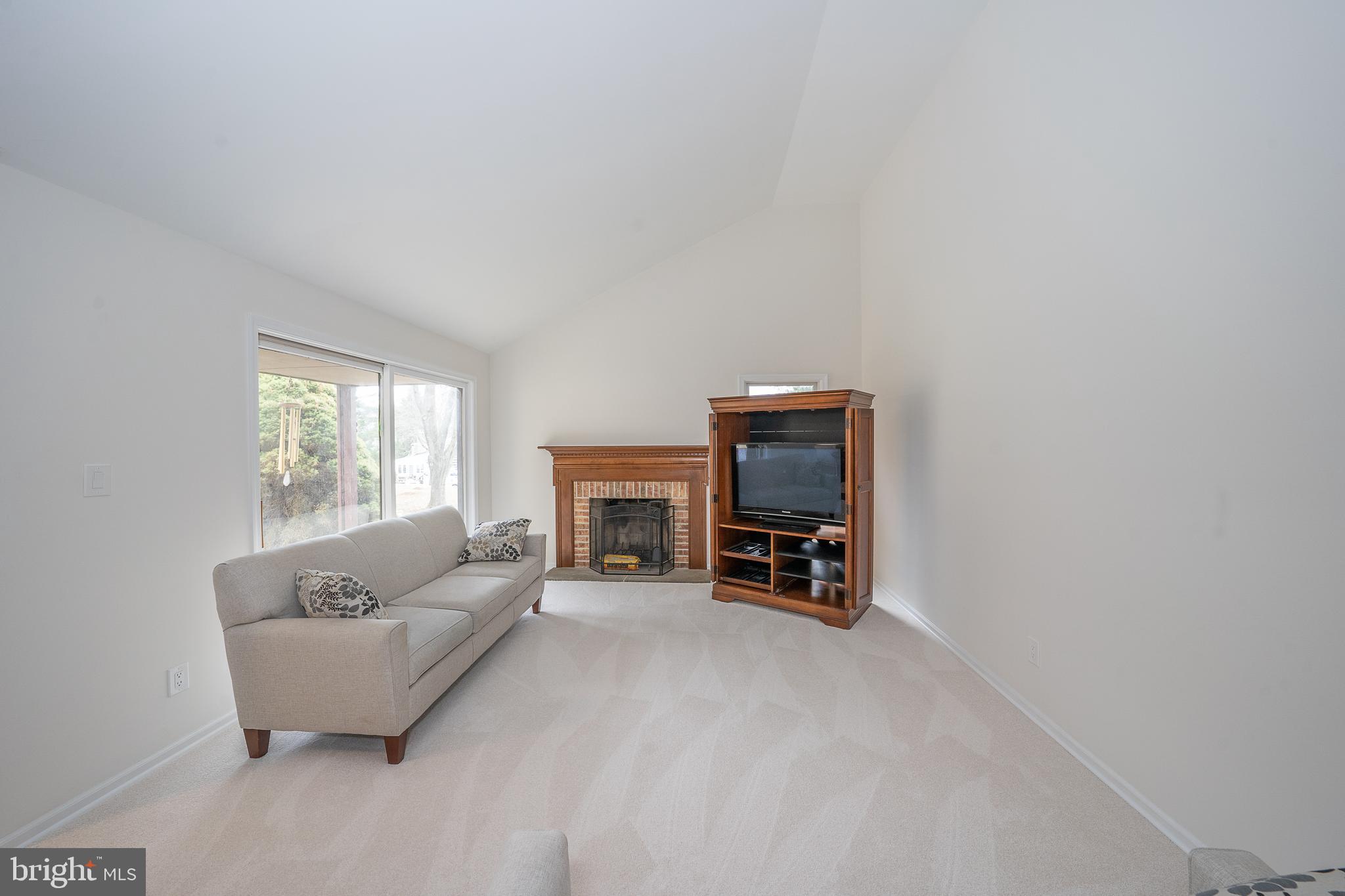 8 Applewood Road Malvern, PA 19355 - Photo 10 of 63 Living Room w/Wood Burning Fireplace & Sliders