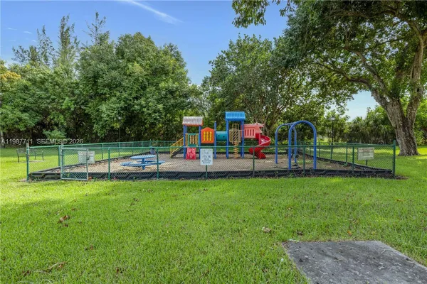 a view of a park with swings